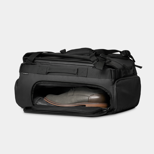 Gomatic Black Travel Bag 30L Side Angle Open Pocket Shoe Storage View